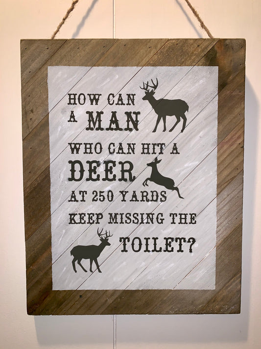 How Can a Man Who Can Hit A Deer At 250 Yards Keep Missing The Toilet Wooden Sign